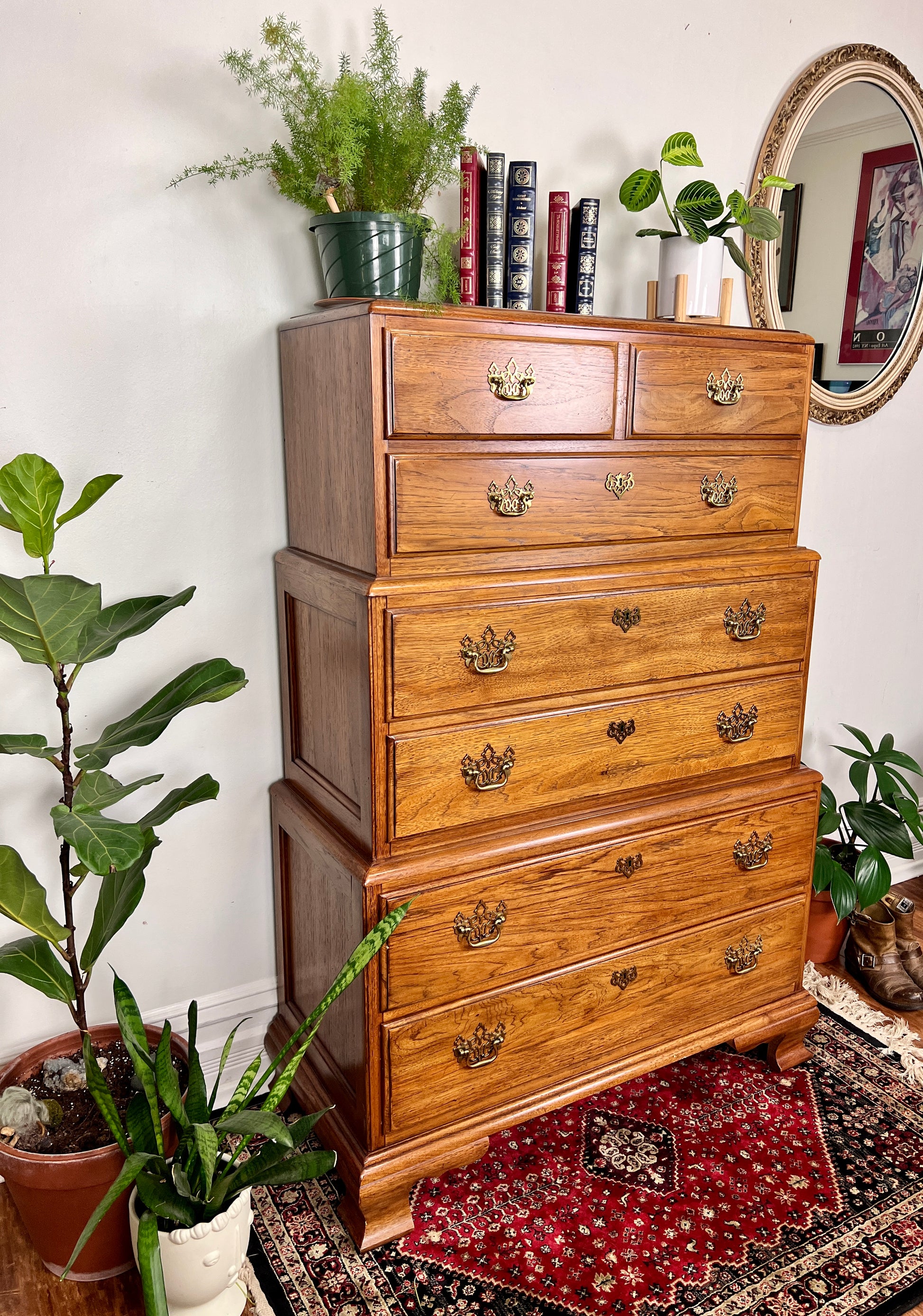 This is a vintage solid wood chest on chest tall boy dresser with seven drawers.