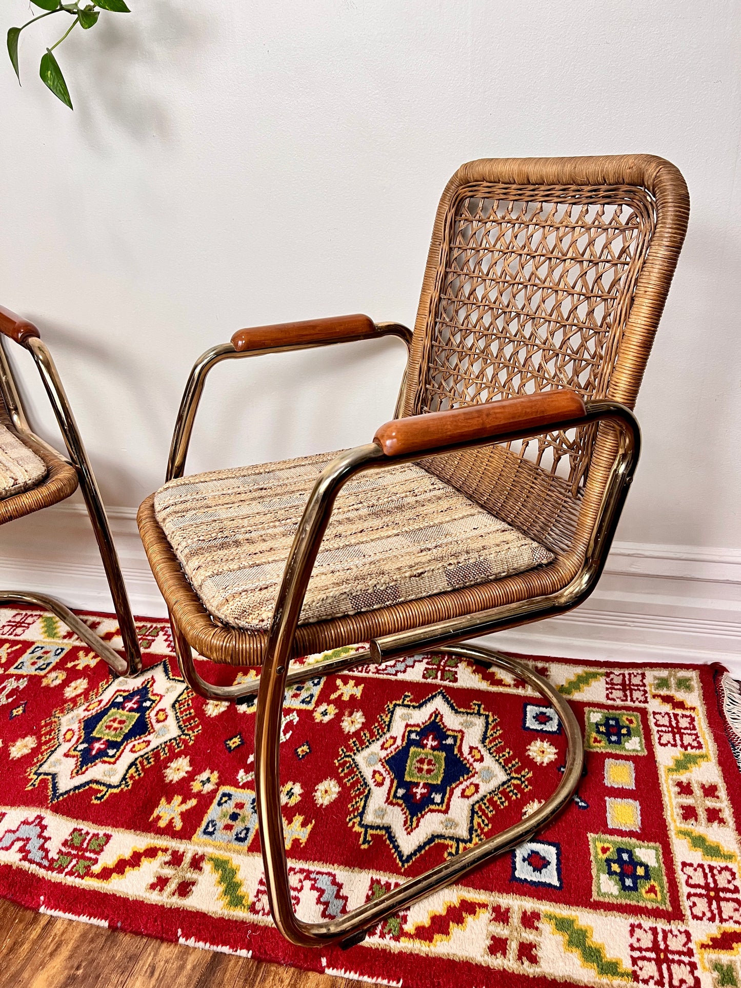 These are funky vintage cesca style cantilever wicker chairs with 60s tweed seat cushions