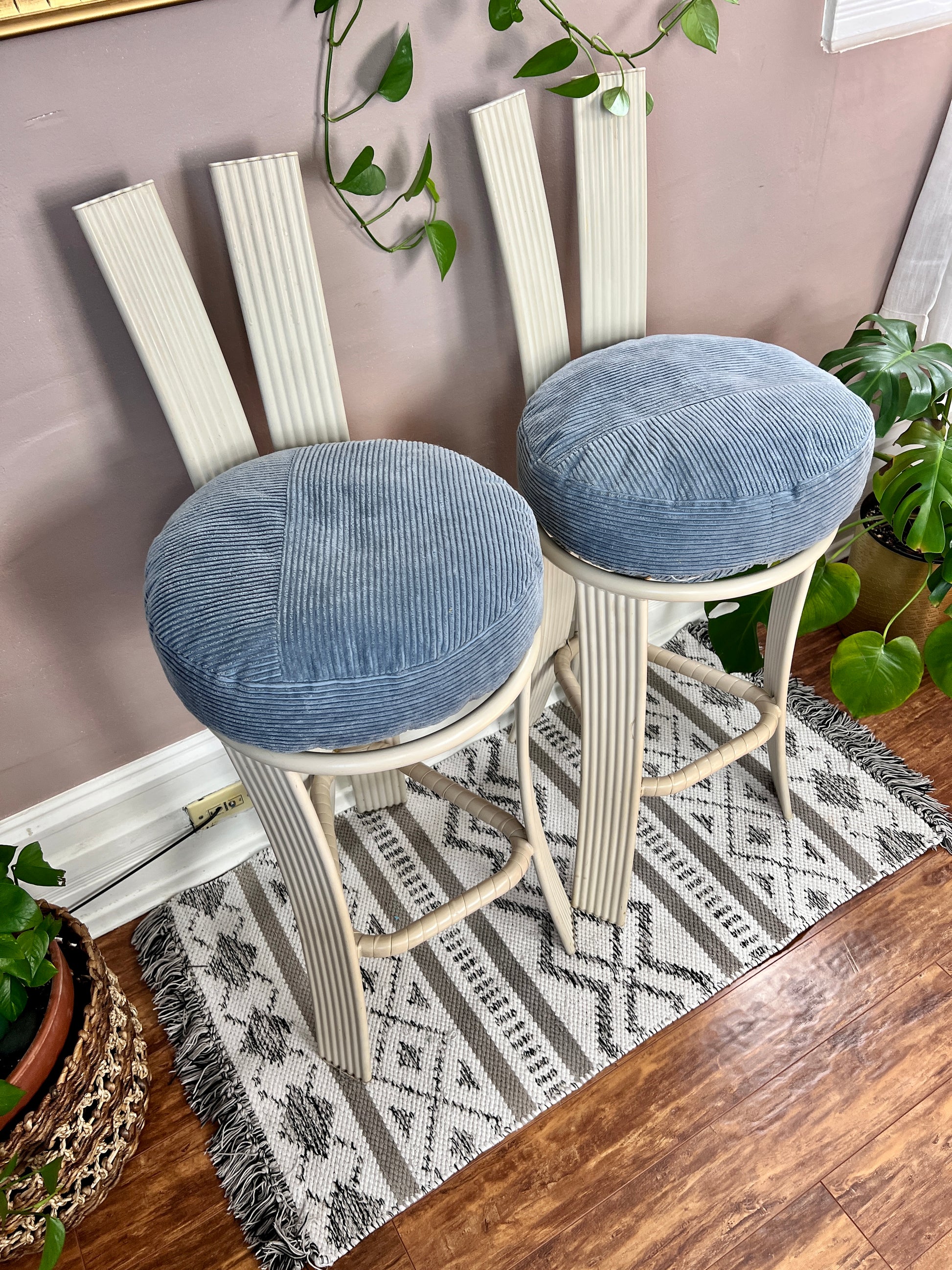 These are 1980s White Metal Tropitone Bar Stools with round baby blue corduroy seat pillows