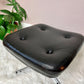This is a black vinyl & chrome eames style ottoman footstool