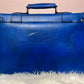 The Blue Leather Attaché